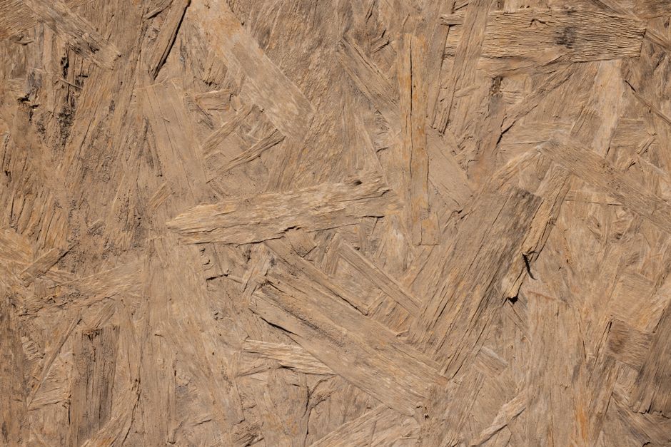 OSB panel exterior cladding being installed on wall